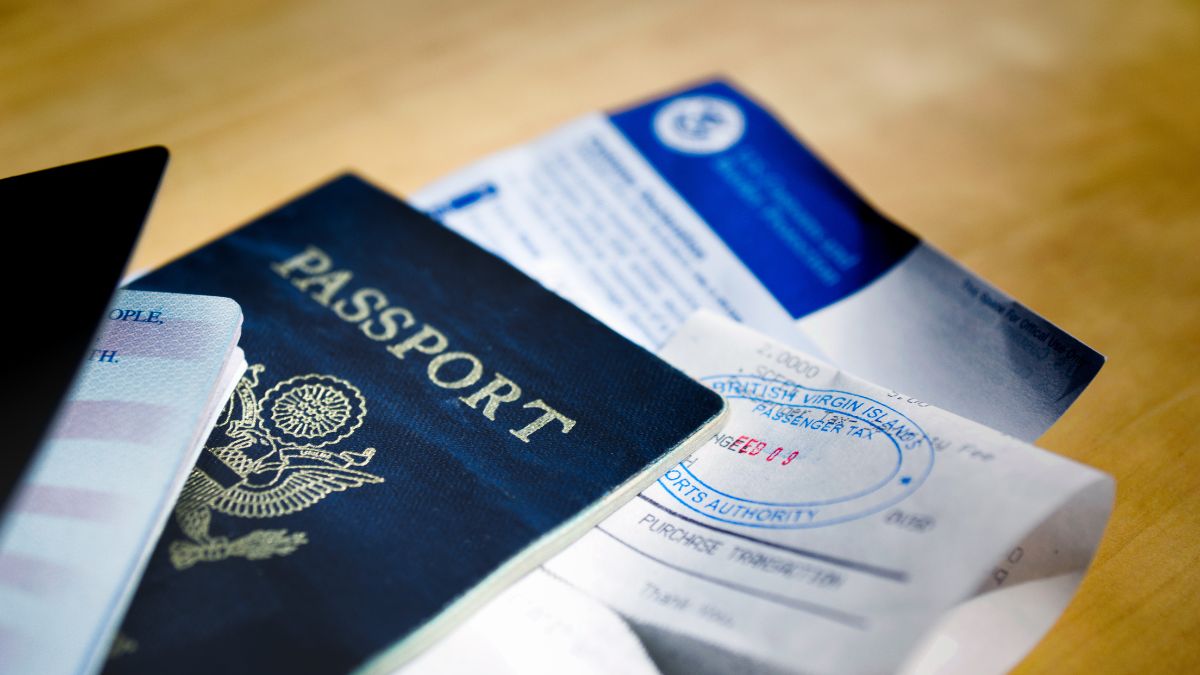 Passport and paperwork on table