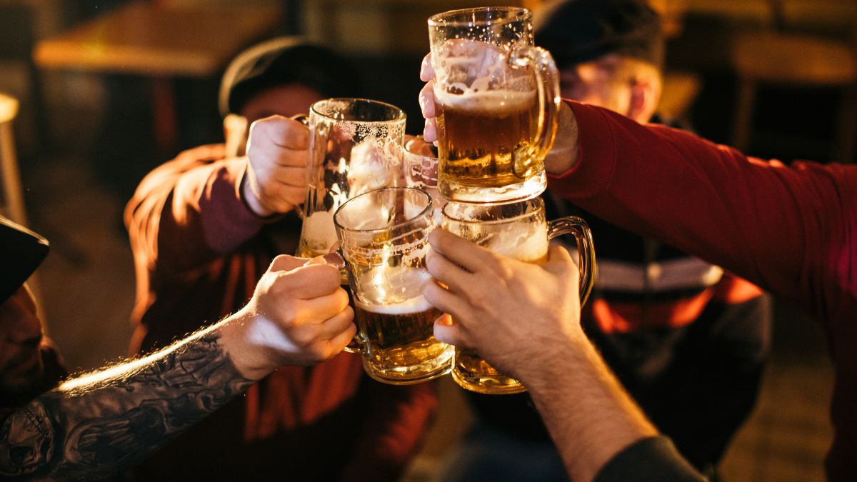 Group of people cheering beers