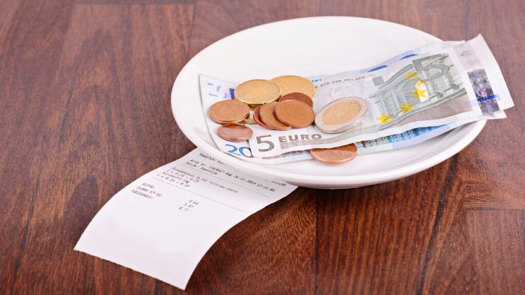 Coins in bowl with a receipt