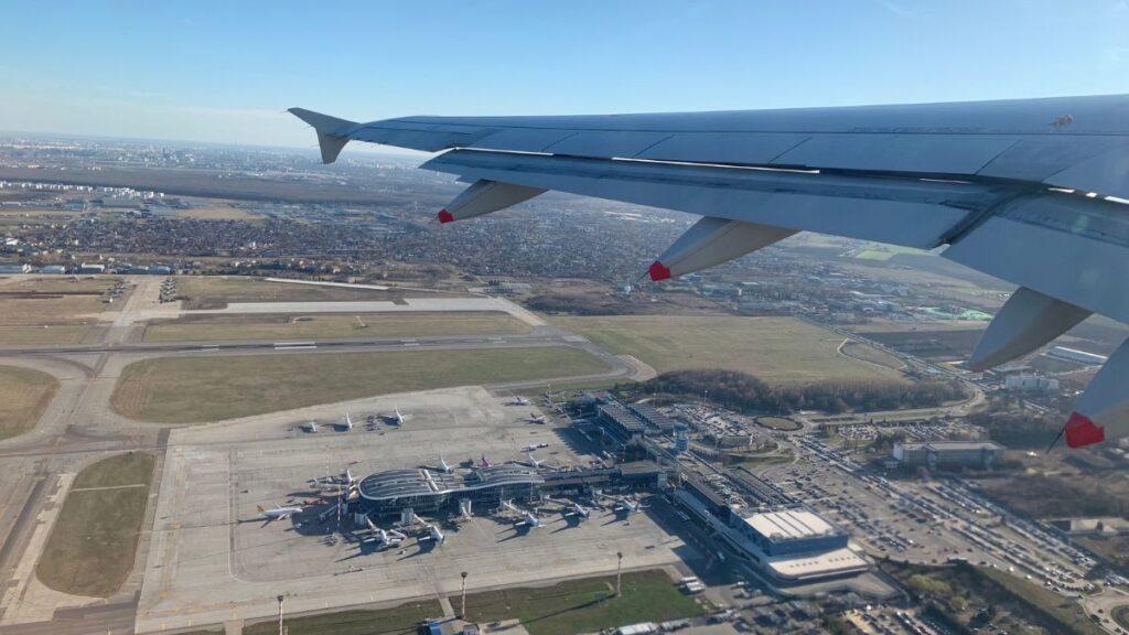Aerial view of Dublin Airport with plane wing in view