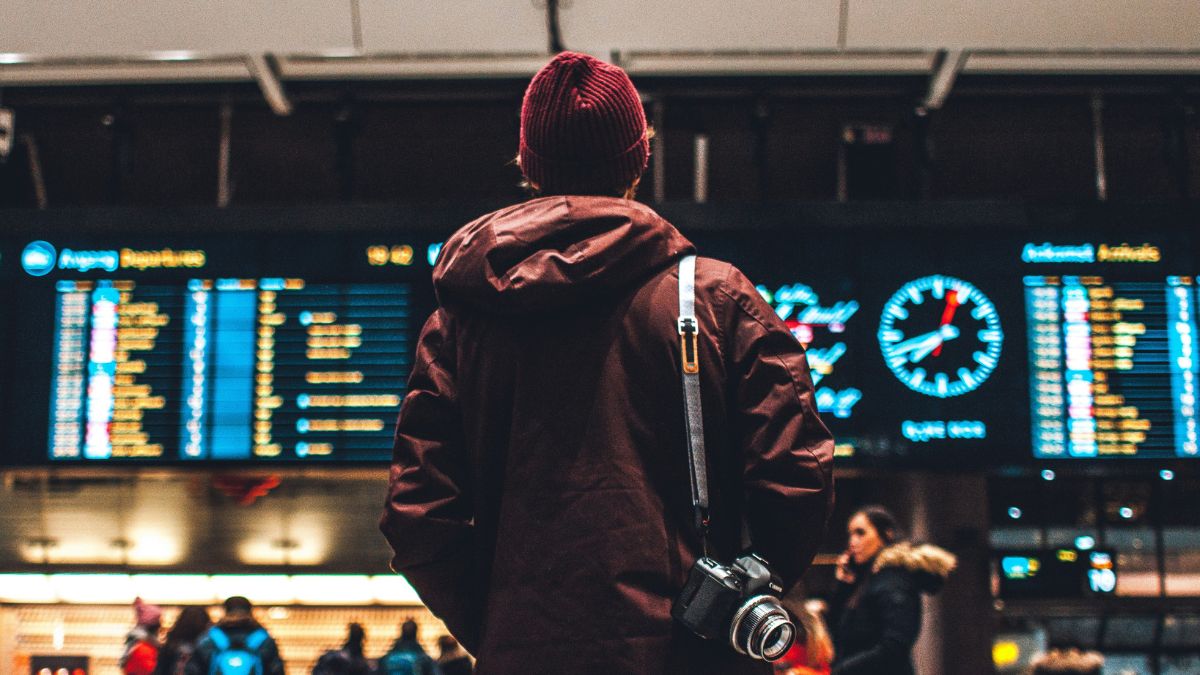 Person looking up to the flight schedule