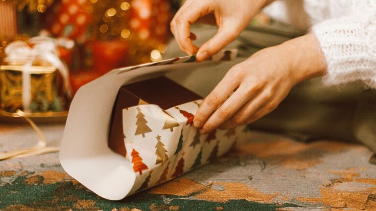 Woman wrapping a Christmas Gift