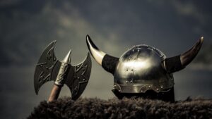 Viking helmet with an axe on a fur coat