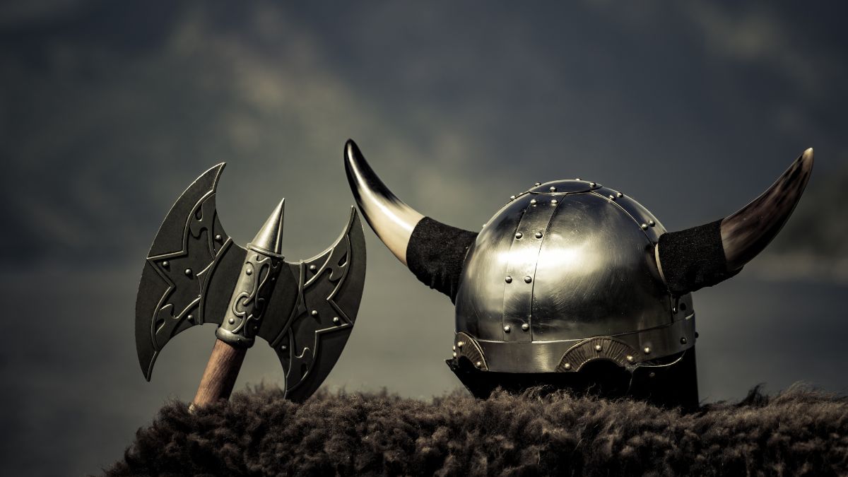 Viking helmet with an axe on a fur coat