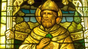 Detail of St Patrick with a shamrock in a stained glass window at the Smith Museum of Stained Glass Windows at Navy Pier in Chicago.