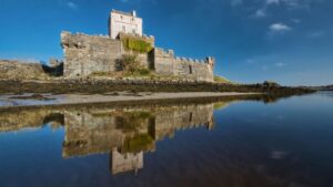 Doe Castle beside a body of water
