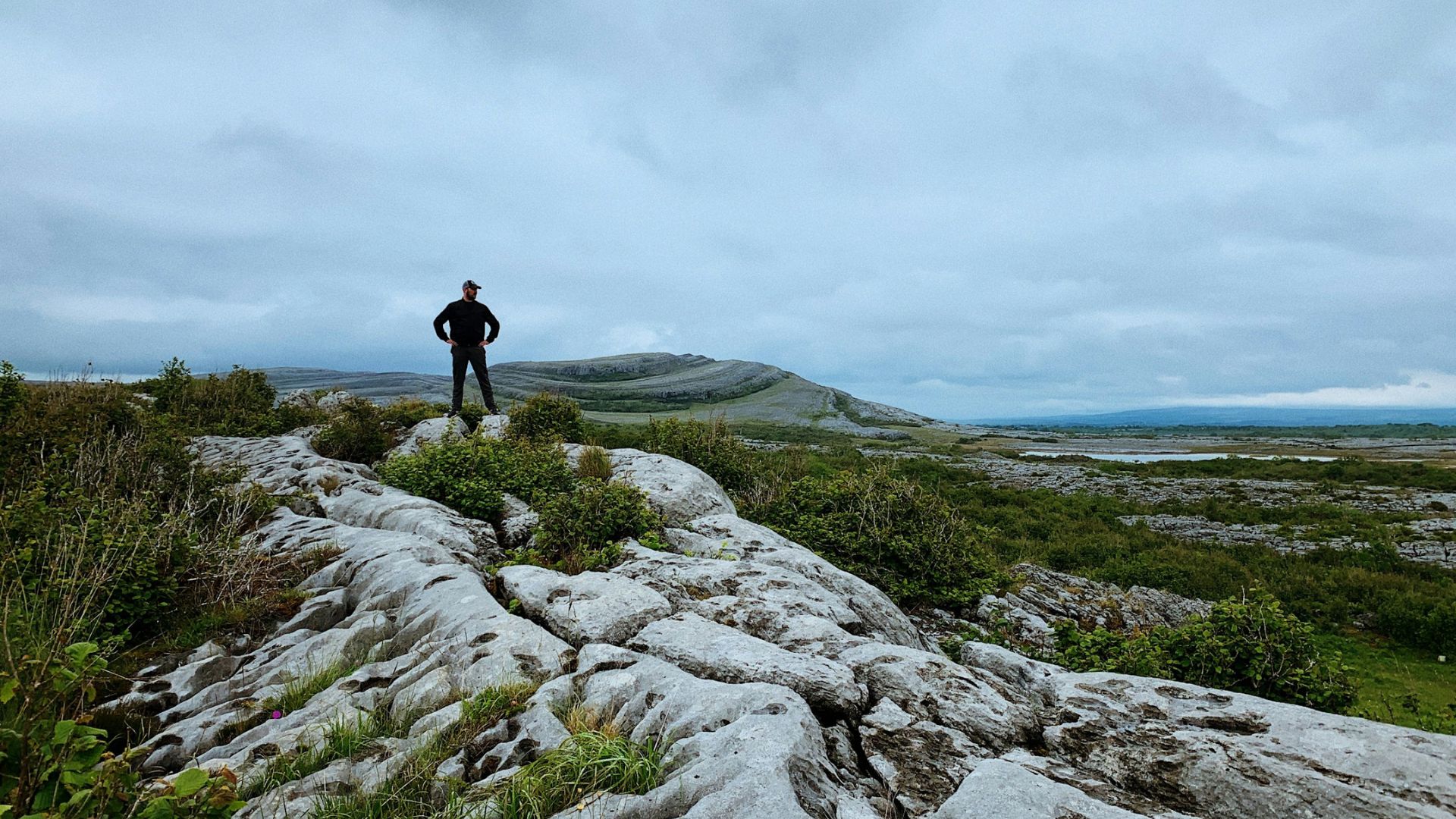 A man standing ontop of the burren limestone